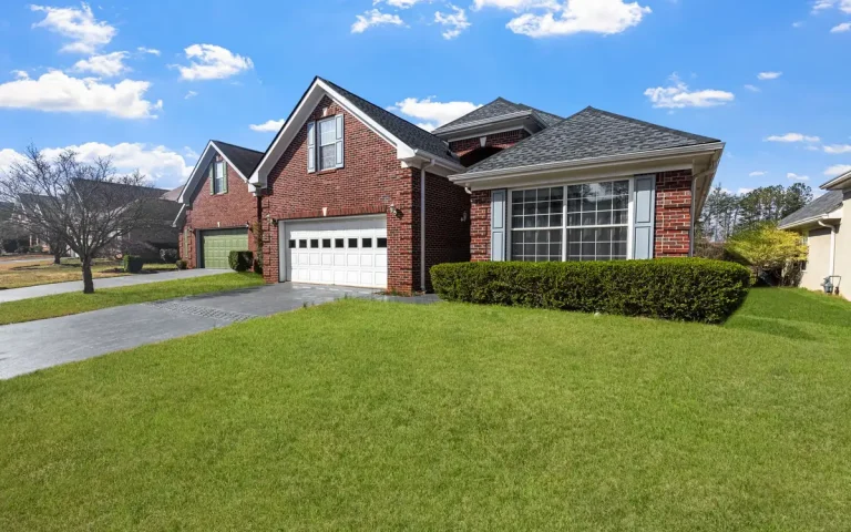 Red brick home with a garage in West Monroe, LA
