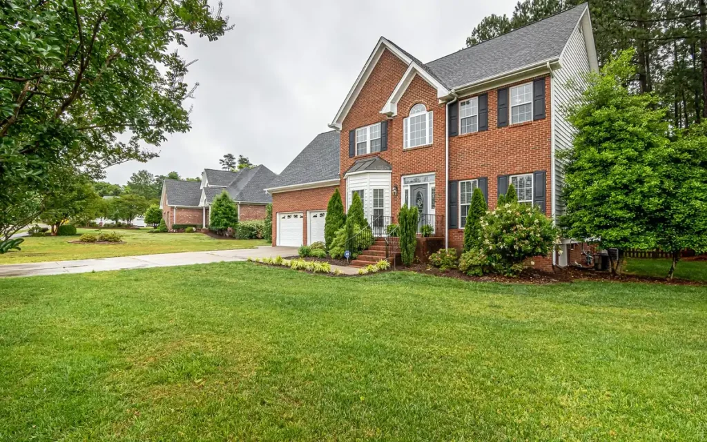 Two-story brick home and lawn in West Monroe